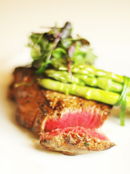 QH cuisine carousel image depicting a steak meal prepared by our chefs